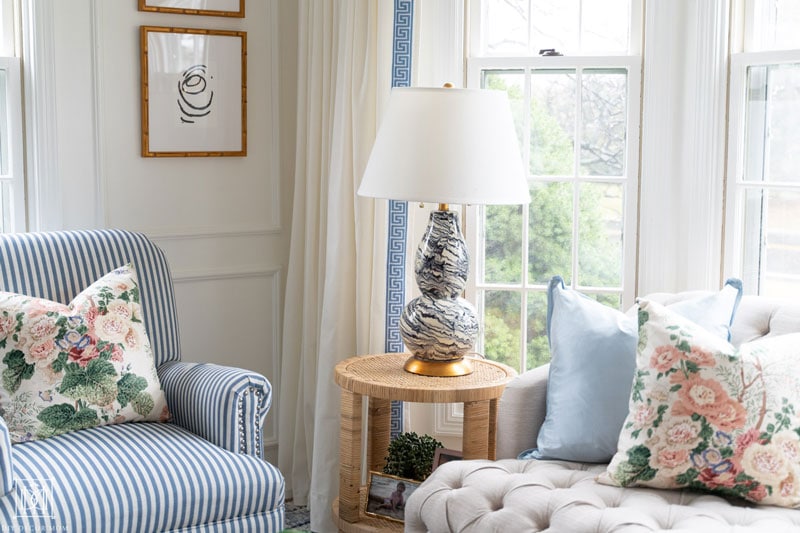 diy lee jofa althea pillows and blue brushstroke lamp in living room